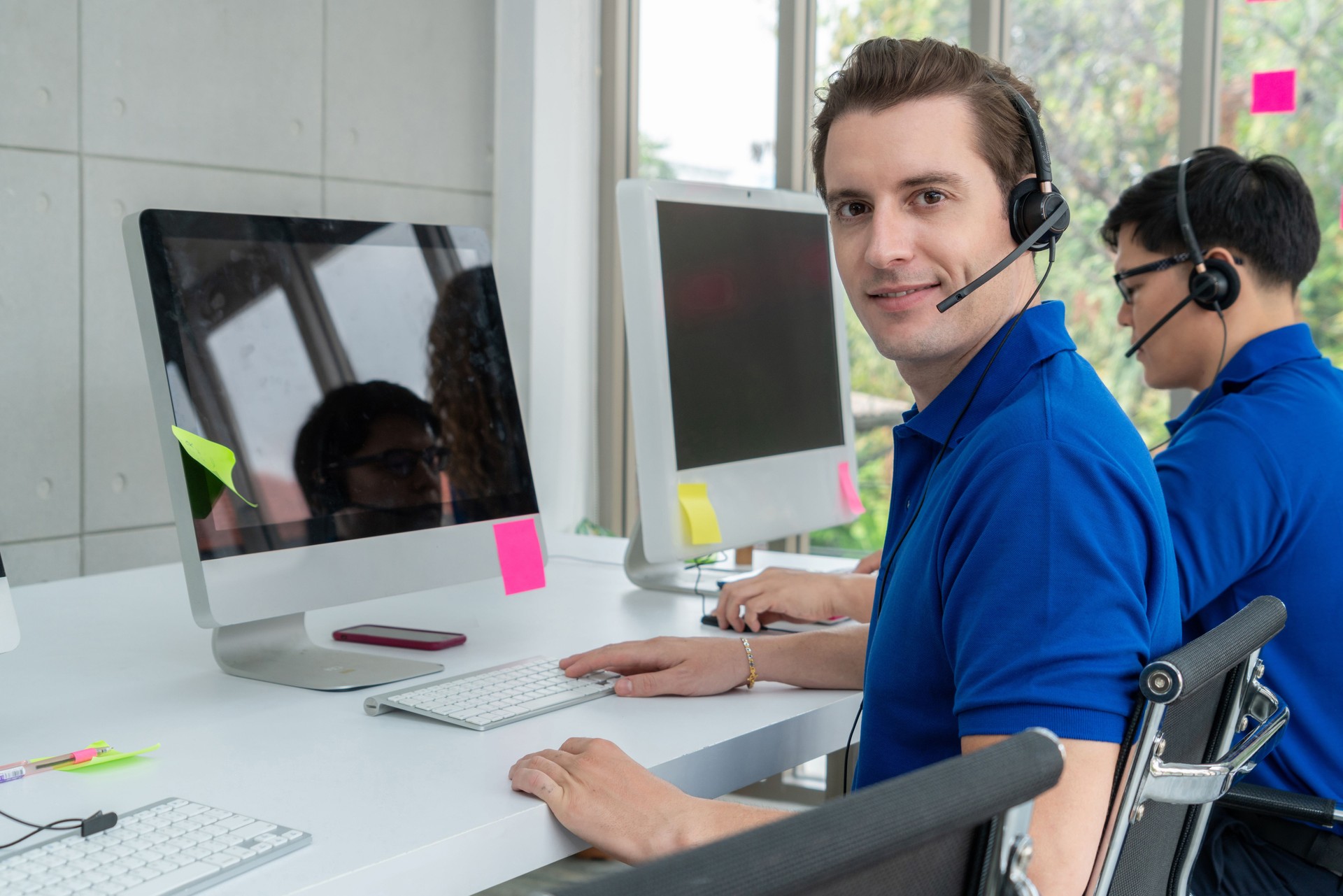 Business people wearing headset working in office