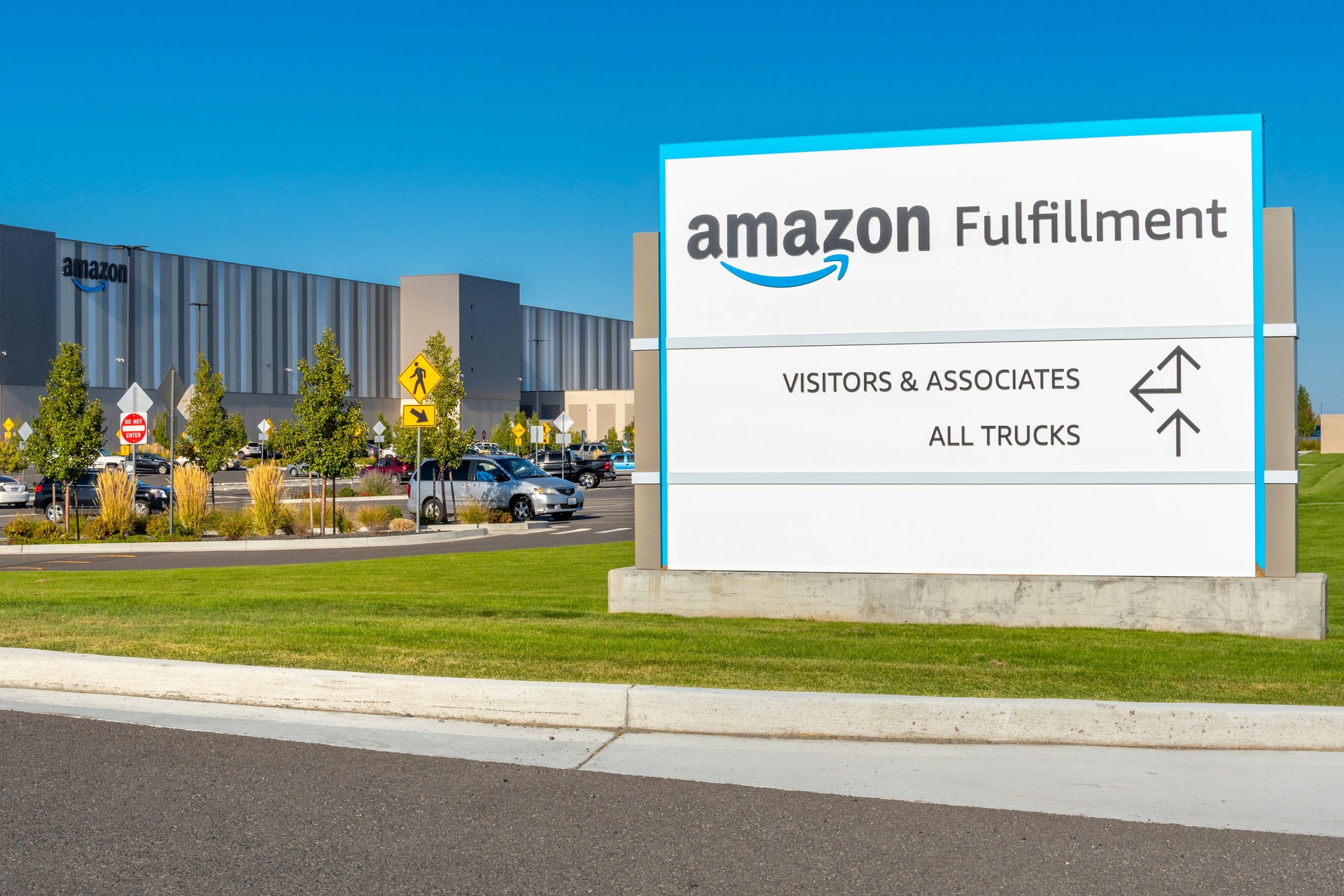 General view of the welcome sign and building of the Amazon Fulfillment Center in Spokane Valley Washington, USA